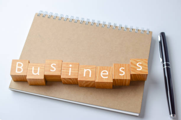 istock Wood block with business word on Notebook with pen 924461728