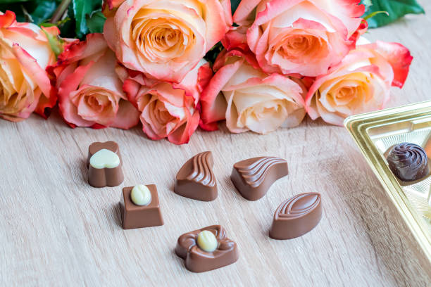 istock sweets and roses on wooden table for gift 924468092