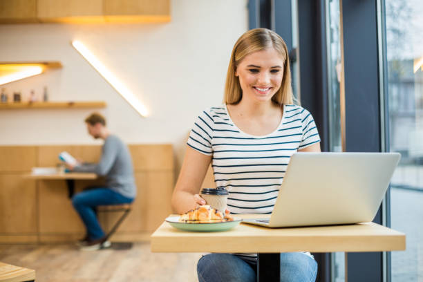 istock Delighted positive woman eating 924469598