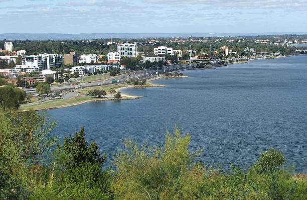istock Cars drive along side a river 92447067