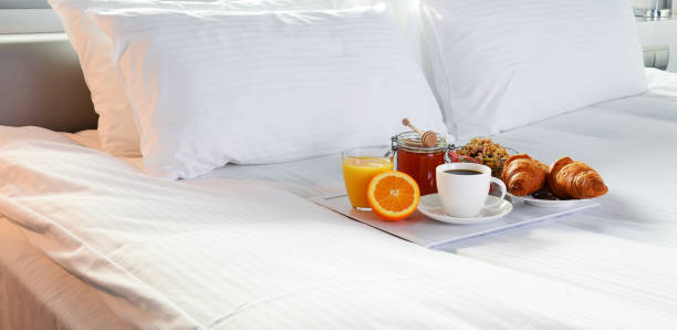 istock Breakfast in bed in hotel room. 924473108