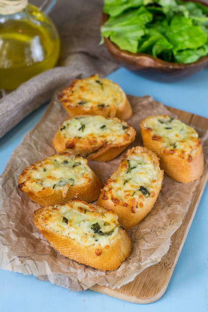 istock Homemade garlic bread with grated cheese and parsley 924475900