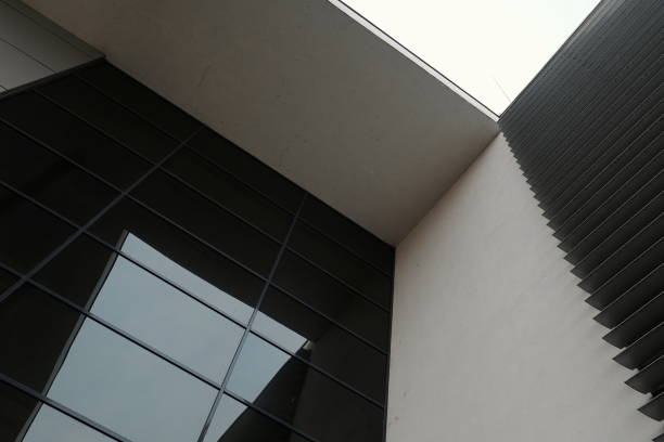 istock Modern building architecture design with glass wall and geometric shapes 924476264
