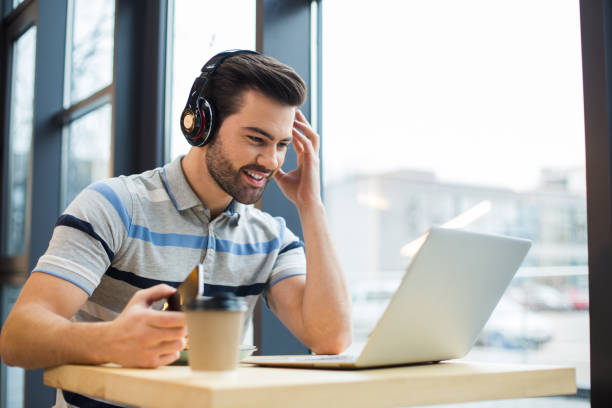 istock Handsome happy man listening to music 924476732