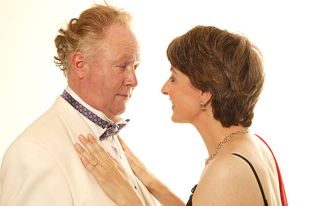 istock mature couple dressed to go to formal dinner 92447917