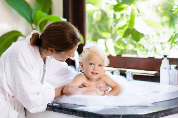 istock Mother washing baby in bubble bath. Water fun. 924483214