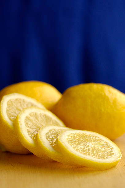 Lemon slices on blue stock photo