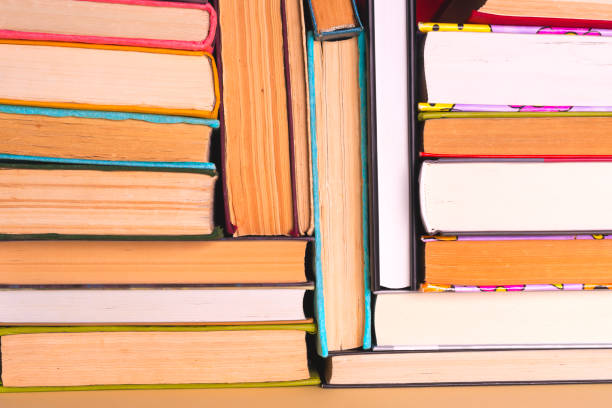 istock Open book, hardback books on bright colorful background. 924490070