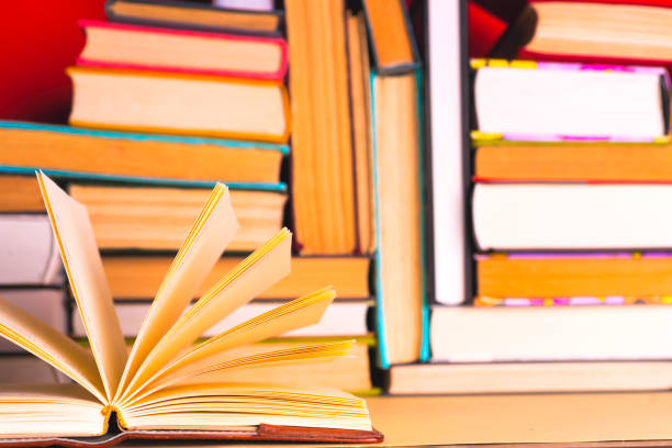 istock Open book, hardback books on bright colorful background. 924490302