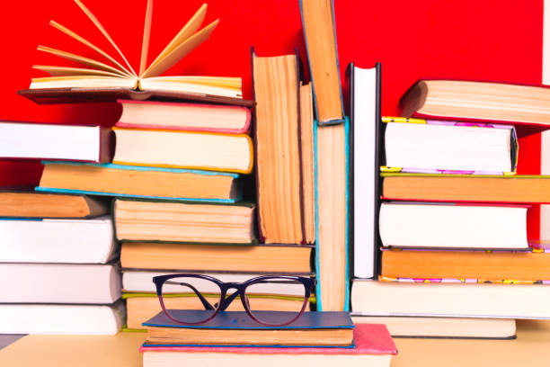 istock Open book, hardback books on bright colorful background. 924490380