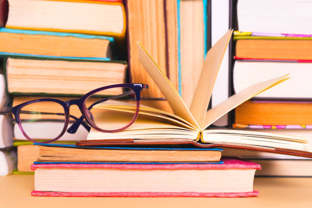 istock Open book, hardback books on bright colorful background. 924490398