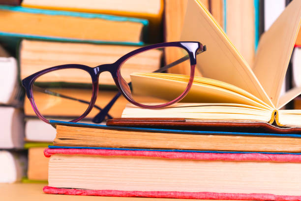 istock Open book, hardback books on bright colorful background. 924490440