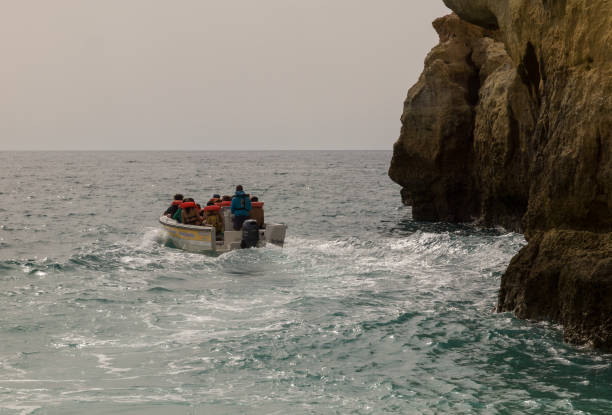 Boat trips. Benagil, Algarve, Portugal. OCT 18, 2017. Boat trips. Tourist visit in boats to travel the coast entering the caves of Benagil with the boat. beautiful beach in carvoeiro algarve portugal stock pictures, royalty-free photos & images