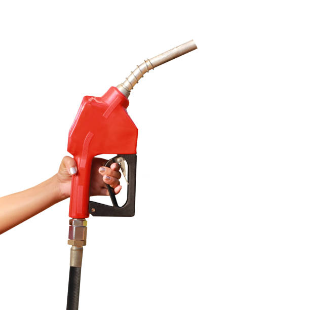 istock Woman hand holding a fuel nozzle on white background 924499160