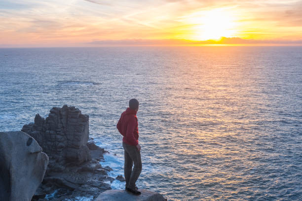 istock Hiker on top of the sea cliff 924504820
