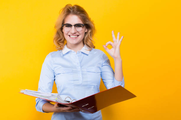 istock Smiling woman with big folder 924505866
