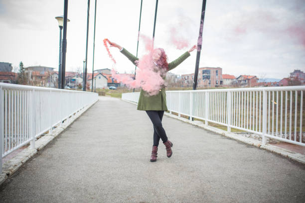 istock Happy and playing with red smoke 924508684