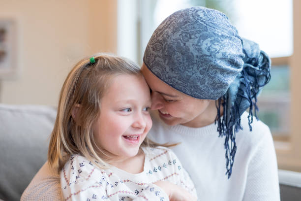 istock Young mom with cancer holds her daughter 924508900