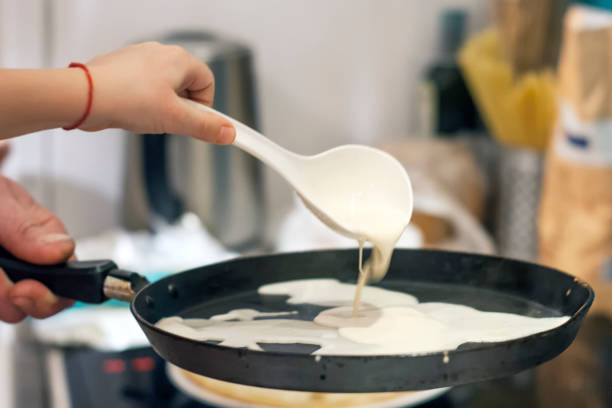 istock Dad and baby bake pancakes for breakfast in 4 hands 924512038