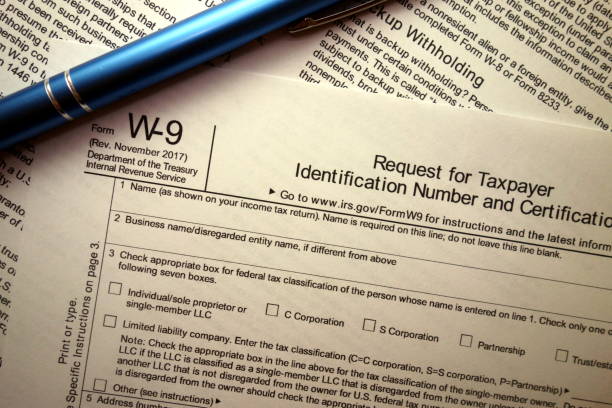 istock Blank W-9 tax form and pen 924512116