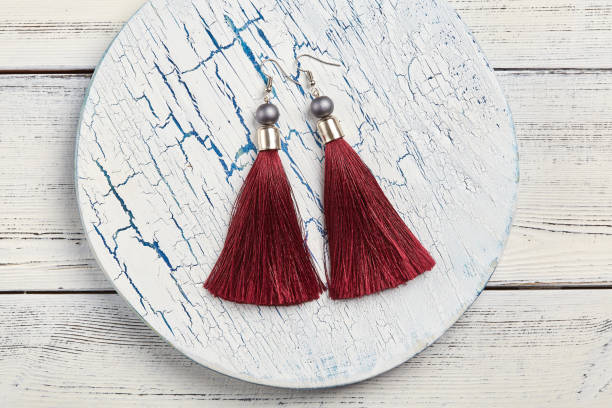 istock Red tassel earrings on white background 924512590