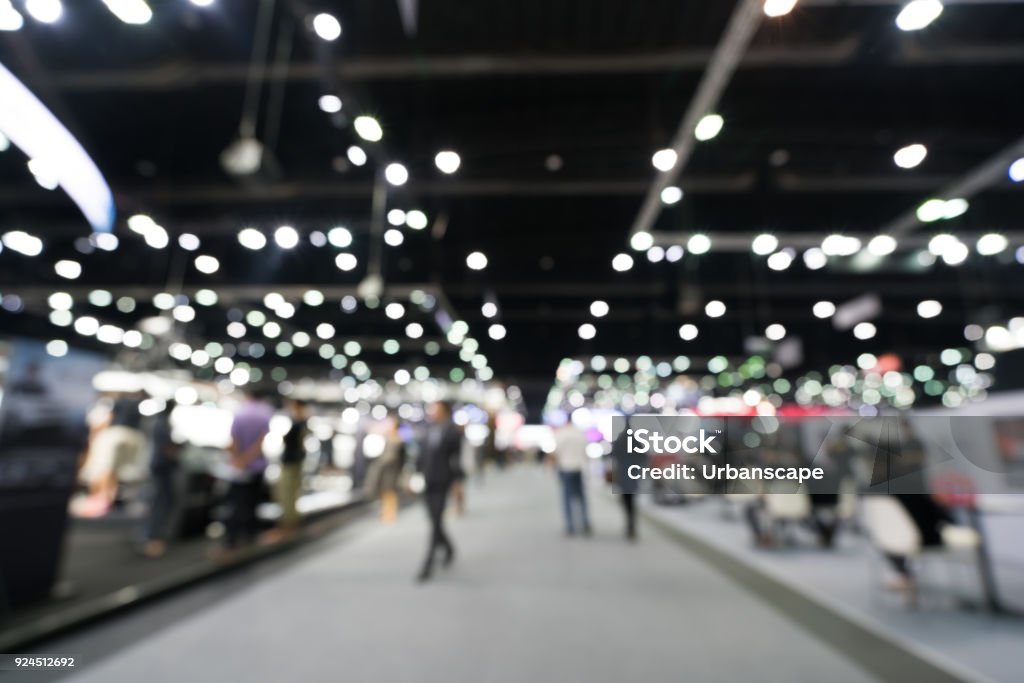 Blurred, defocused background of public exhibition hall. Business tradeshow or stock market, organization or company event, commercial trading fair, or shopping mall marketing advertisement concept Exhibition Stock Photo Blurred, defocused background of public exhibition hall. Business tradeshow or stock market, organization or company event, commercial trading fair, or shopping mall marketing advertisement concept Exhibition Stock Photo