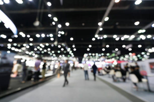 Blurred, defocused background of public exhibition hall. Business tradeshow or stock market, organization or company event, commercial trading fair, or shopping mall marketing advertisement concept Blurred, defocused background of public exhibition hall. Business tradeshow or stock market, organization or company event, commercial trading fair, or shopping mall marketing advertisement concept entrance hall stock pictures, royalty-free photos & images