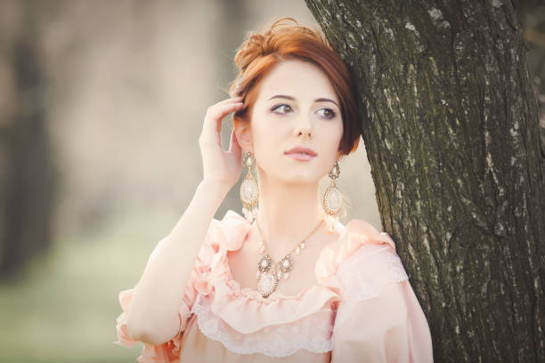 istock Young redhead girl in Victorian era clothes 924513608