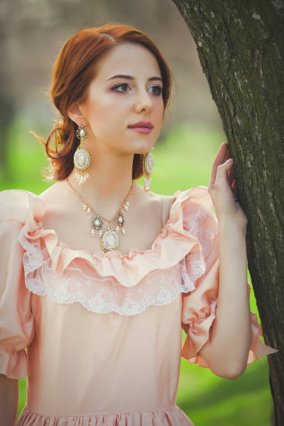 Young redhead girl in Victorian era clothes