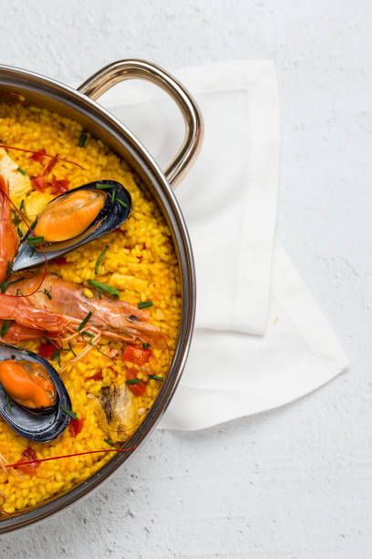 Traditional rice in paella with fish and meat. Typical Spanish