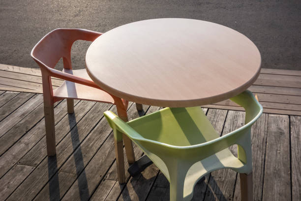 istock Beautiful pink wooden round table with chairs 924517414