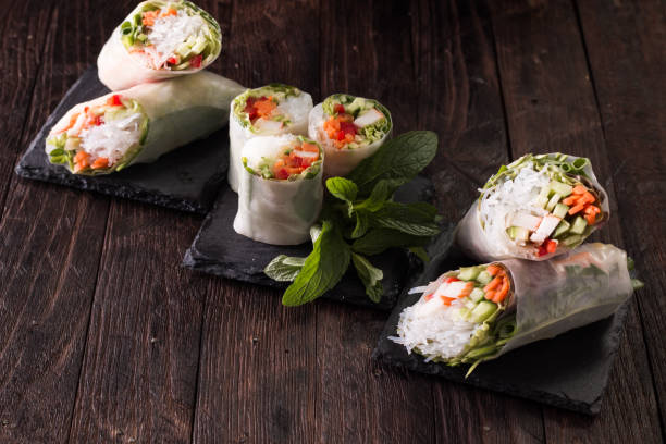 istock Delicious vietnamese spring roll with vegetable on dark background ,healthy food 924517652