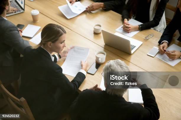 Negotiations Concept Different Businesspeople Discussing Deal Details At Group Meeting Stock Photo - Download Image Now