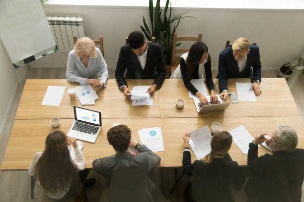 istock Multiracial business people working together at conference table, top view 924520296