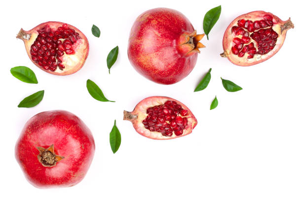 istock pomegranate with leaves isolated on white background with copy space for your text. Top view. Flat lay pattern 924521096