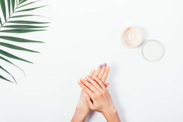 istock Woman rubbing cream on hand 924521696