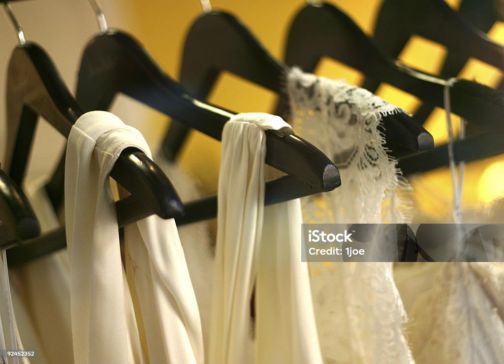 Lace dresses closeup on lace dresses on hangers.  DOF Closet Stock Photo