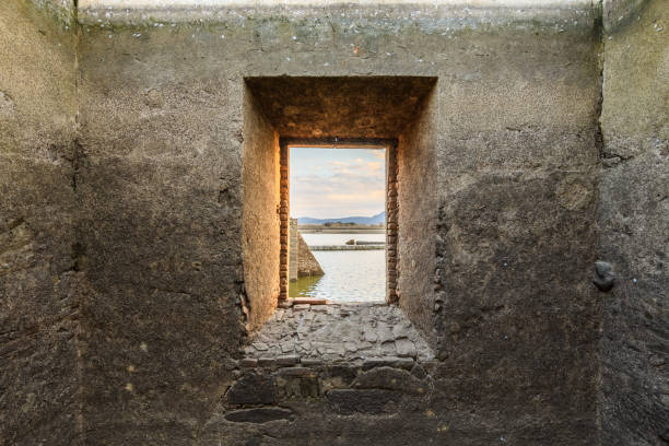 landscape through a window of a few ruins