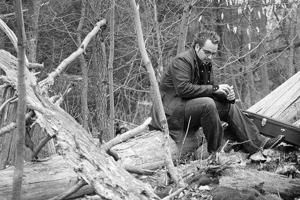istock guitarist in the woods 92452494