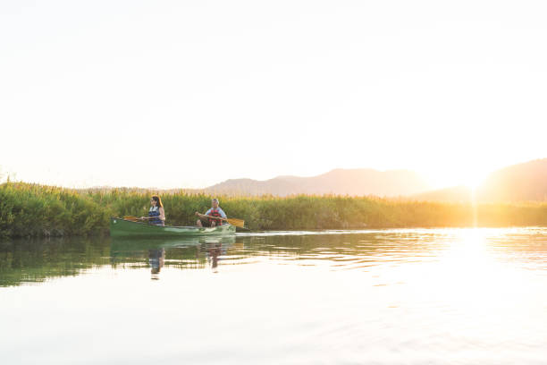istock Canoeing Together on a Beautiful Lake 924532114