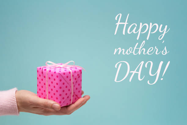 istock Happy mother's day greeting card with woman's hand and gift box. 924532302