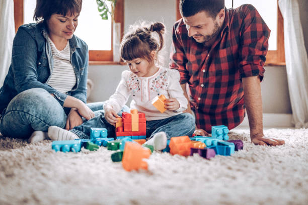 istock Sweet child playing with parents 924532700