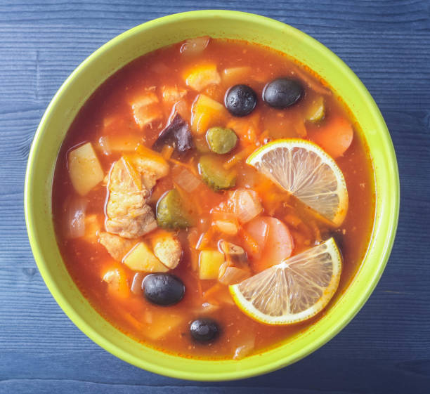 istock meat soup with salted cucumbers and olives close up 924533430
