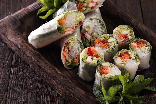 Delicious vietnamese spring roll with vegetable on dark background ,healthy food