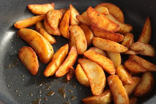 Photo of Homemade roasted potato in frying pan