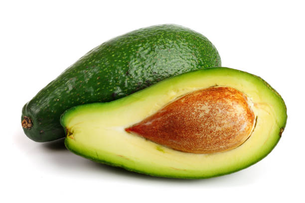 istock avocado and half isolated on white background close-up 924541528