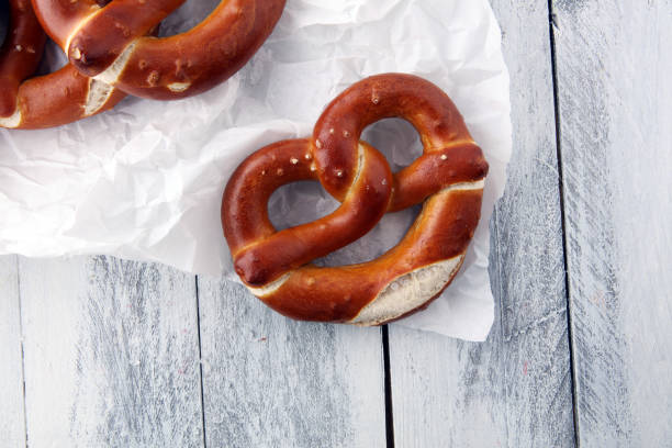 istock German pretzels with salt close-up on the table. 924545030
