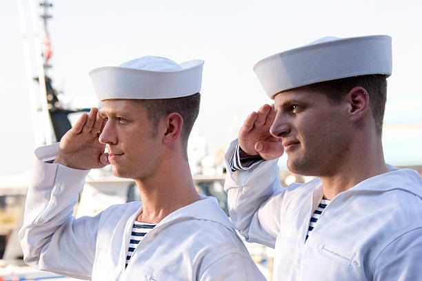 two navy sailors saluting on a ship - matros bildbanksfoton och bilder