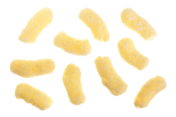 istock Sweet crunchy corn sticks or snacks isolated on white background. Top view. Flat lay 924554698