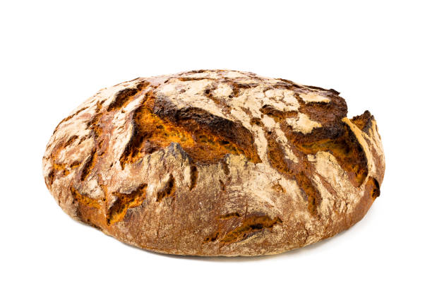 Loaf of bread isolated on white background Single loaf of rustic bread isolated on white background, front view, closeup. loaf of bread stock pictures, royalty-free photos & images
